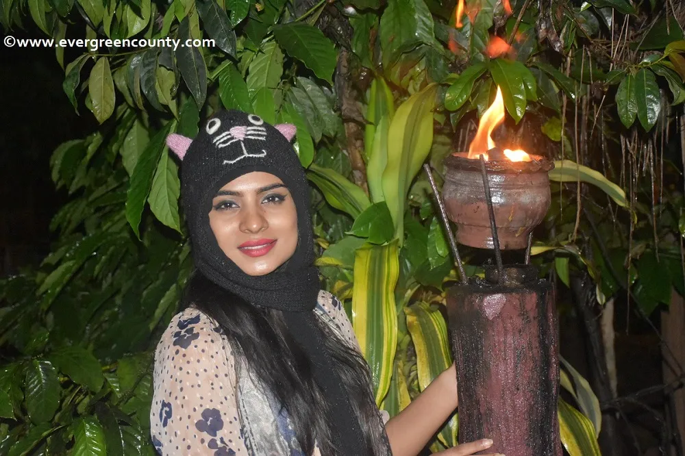 Guest with lantern on a night plantation walk