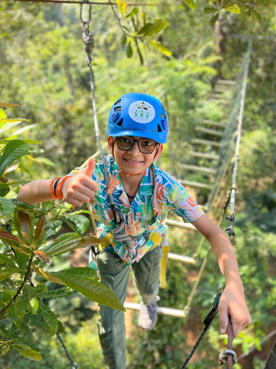 Child crossing the balancing rope bridge
