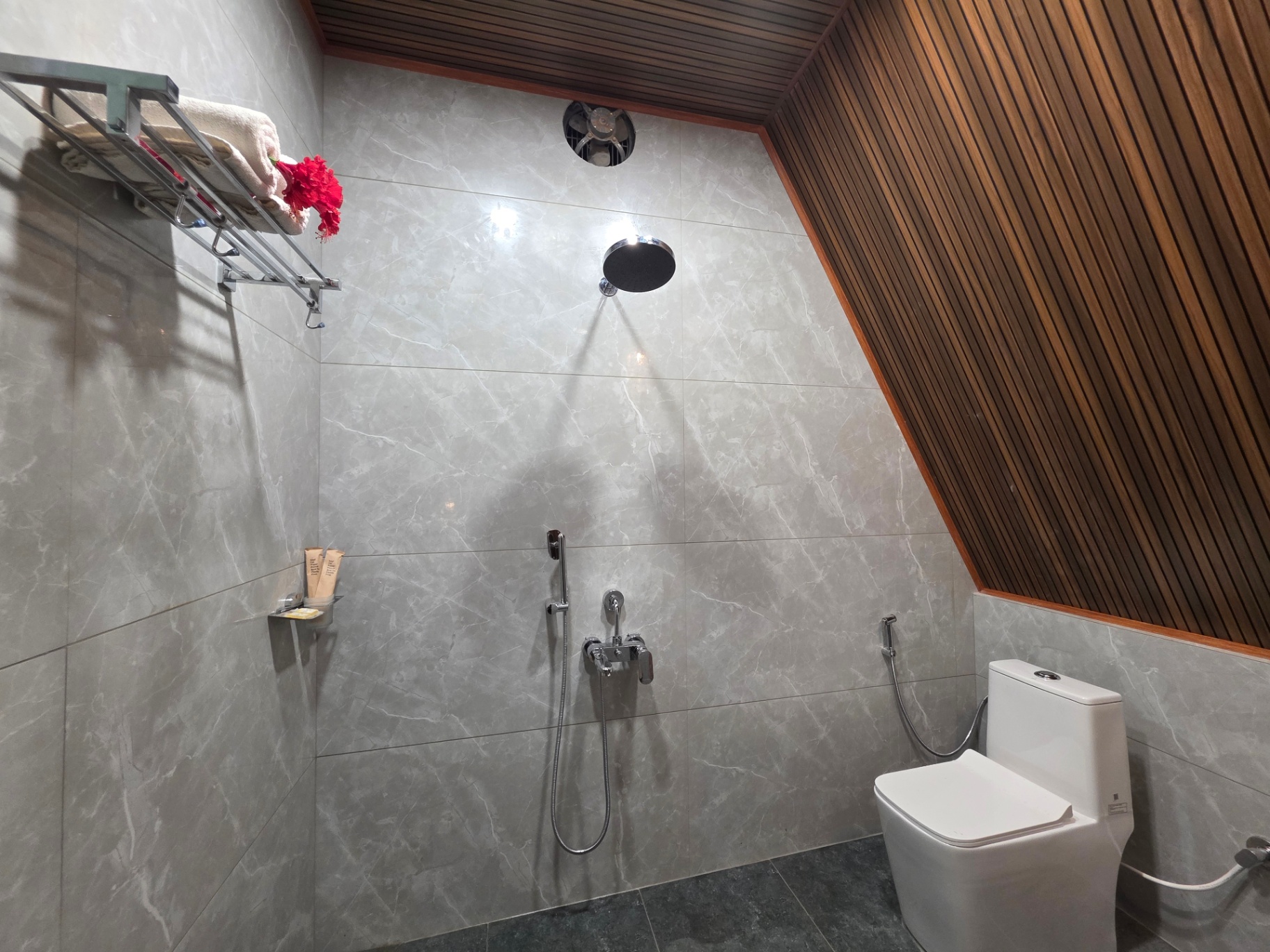 A-frame cottage marble bathroom with rain shower