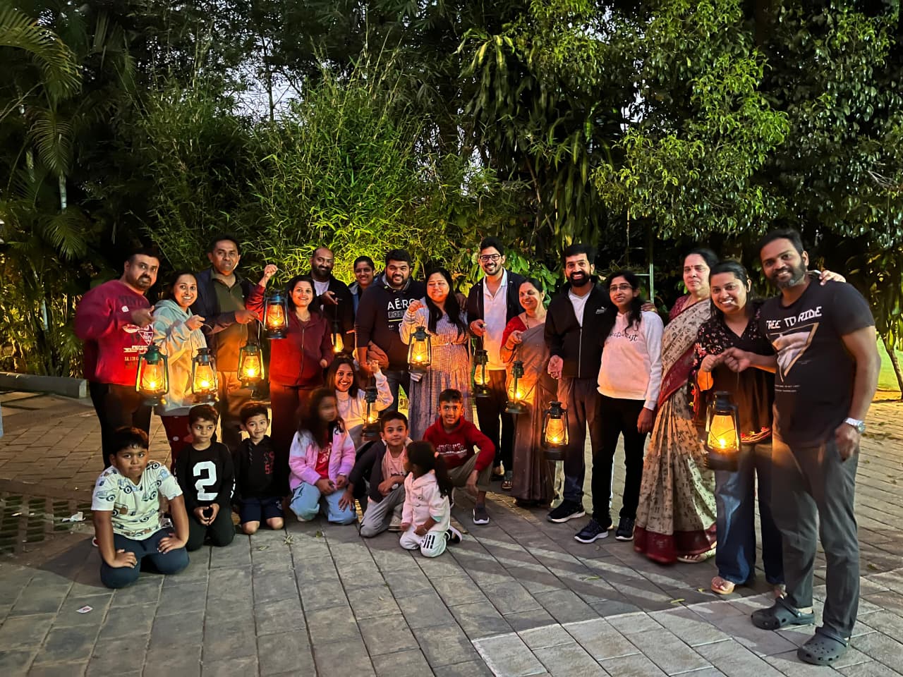 Extended family holding lanterns together at Evergreen County
