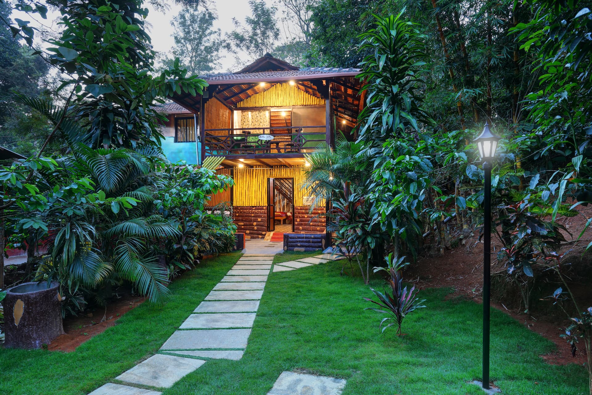 Group Wooden Cottage cover — wooden cottage surrounded by greenery