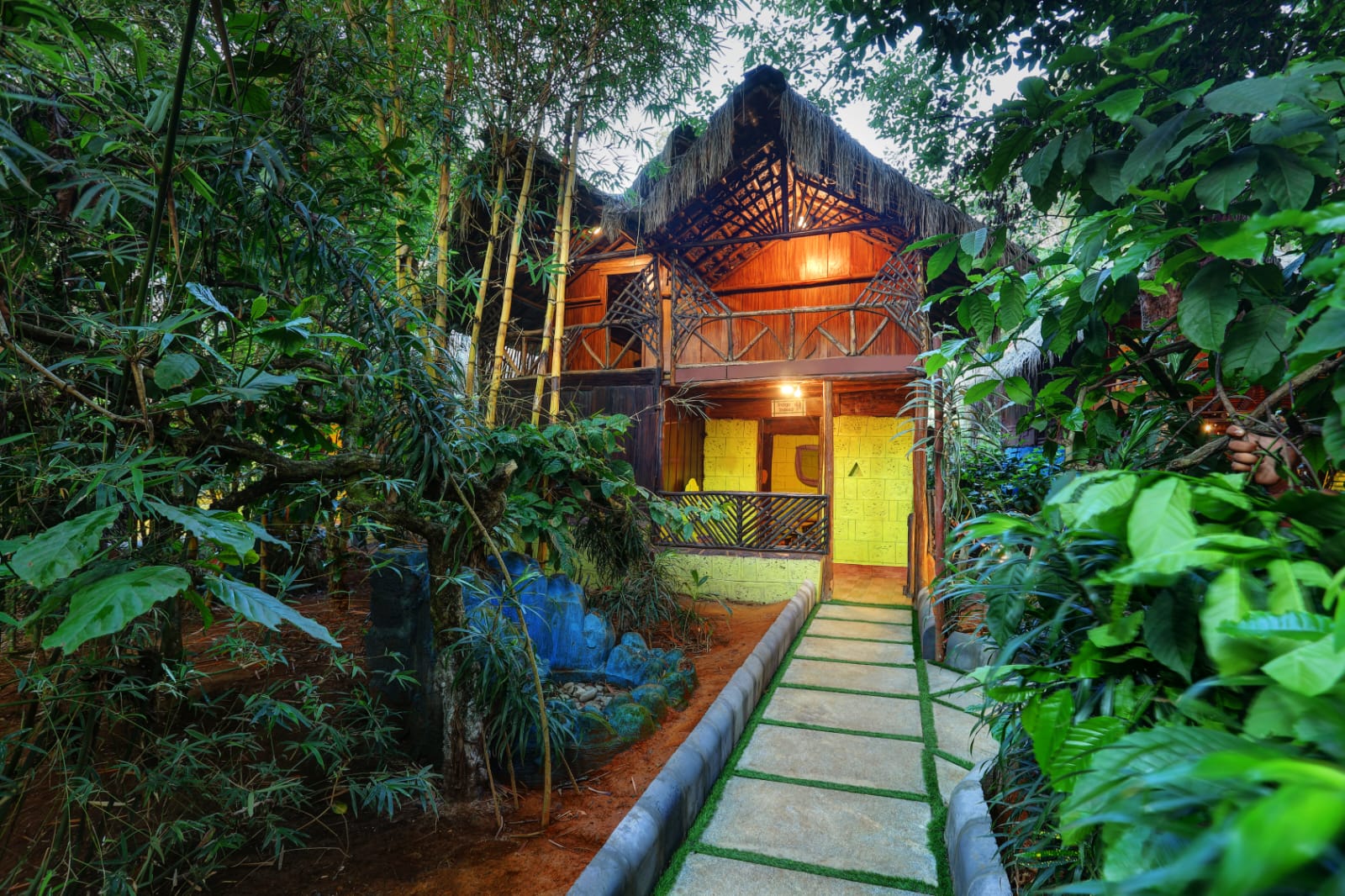 Family wooden cottage exterior amid forest